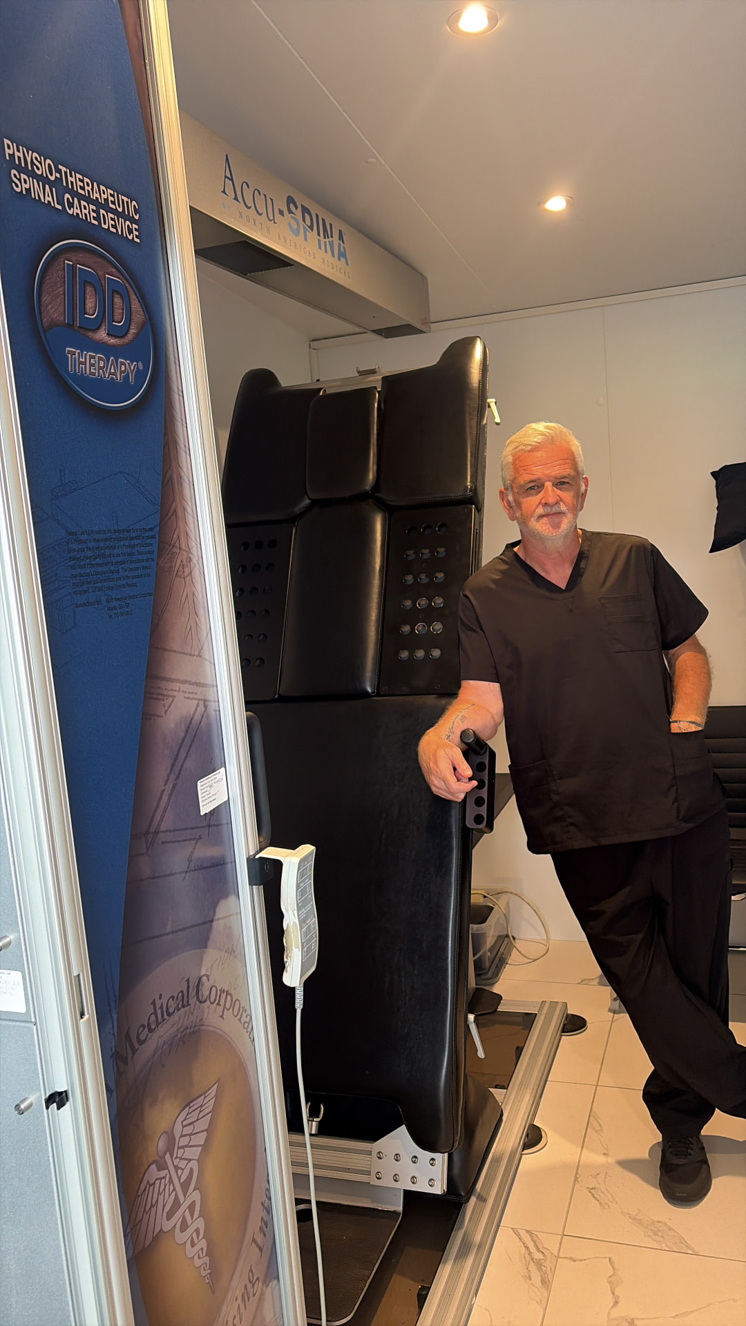 Practitioner with the Accu-SPINA IDD Therapy machine